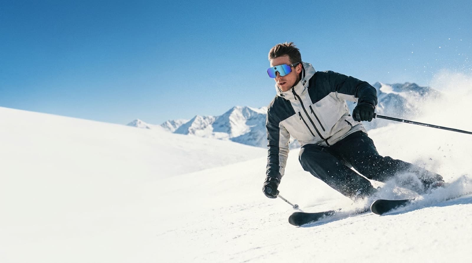 A skier wearing OXIVUE M14 sports AI glasses on an alpine slope